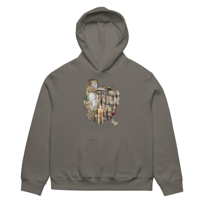 A dark gray pullover hoodie with a vintage-style collage graphic on the chest depicting a figure holding a lantern and candles, shown against a plain white background.
