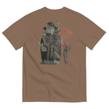 A brown short-sleeve t-shirt shown from the back, featuring a graphic print of a dark, textured figure in a hat with red abstract text and paint splatter details.