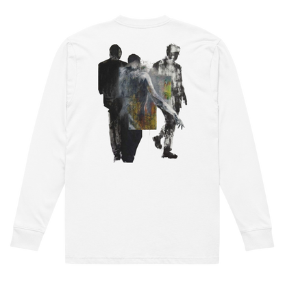 A white long-sleeve t-shirt shown from the back, featuring a large graphic print of three walking figures in a textured, painterly style with black, gray, and yellow accents.