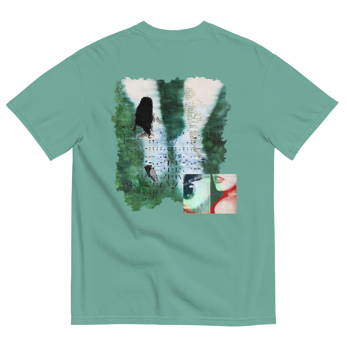 Green t-shirt with a graphic design on the back featuring surreal nature elements with emotions