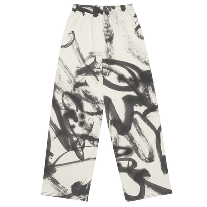 Trousers with black abstract brushstroke pattern on a white background