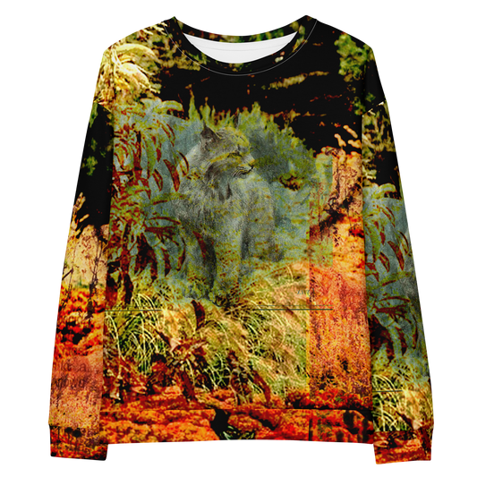 A long-sleeve crewneck sweatshirt featuring a detailed, painterly nature print of a gray wolf surrounded by green ferns and warm orange-brown foliage, shown against a plain white background.