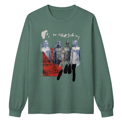 A sage green long-sleeve t-shirt with a graphic print on the front. The graphic features the word 'watching' in a distressed white font above a collage of four figures in blue, gray, and black tones, with a red textured block on the left side.