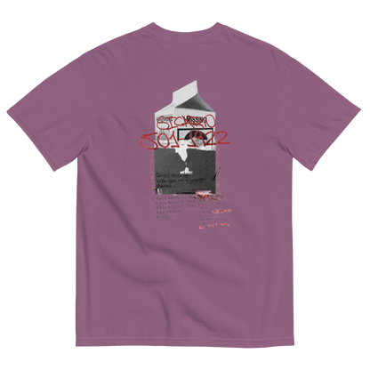 A mauve purple t-shirt shown from the back, featuring a graphic print of a milk carton with graffiti-style red and black text reading 'STANKE' and '301 142'.