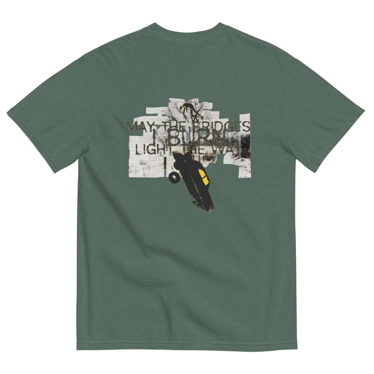 A sage green short-sleeve t-shirt shown from the back, featuring a large graphic print of a skateboarder in a black and yellow skateboard with the text 'MAY-THE BRIDGES BURN LIGHT THE WAY' over a collage background.