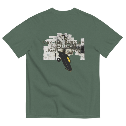 A sage green short-sleeve t-shirt shown from the back, featuring a large graphic print of a skateboarder in a black and yellow skateboard with the text 'MAY-THE BRIDGES BURN LIGHT THE WAY' over a collage background.
