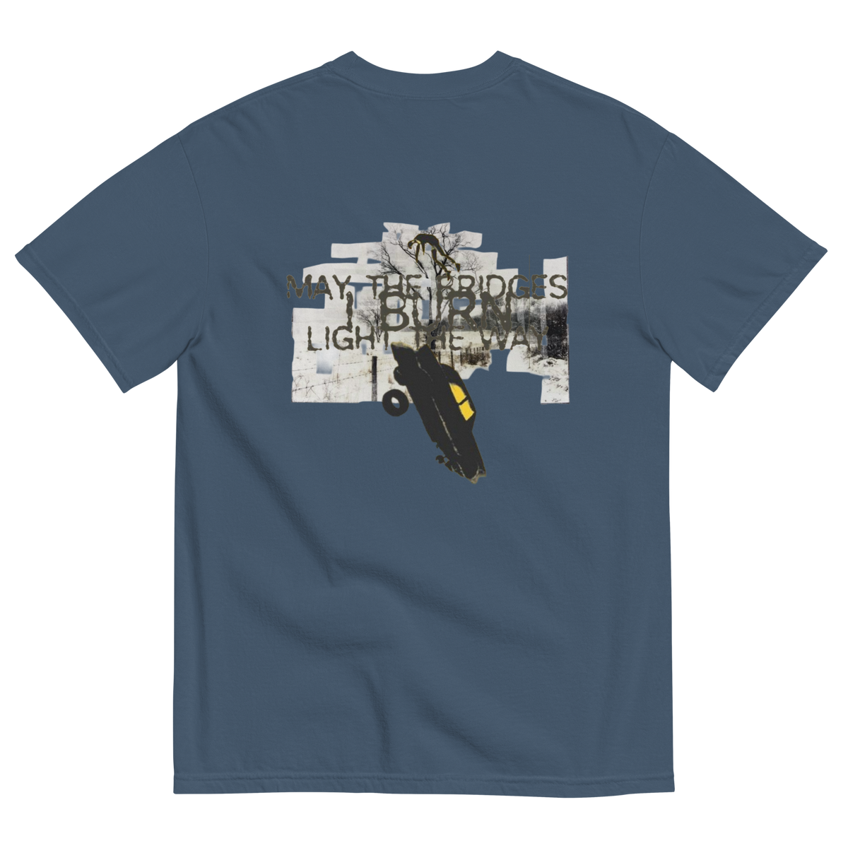 A blue-gray crewneck t-shirt shown from the back, featuring a graphic print with the text 'WAY THE BRIDGES ARE BURNT, LIGHT THE WAY' and an illustration of a black car with a yellow window on a white collage background.