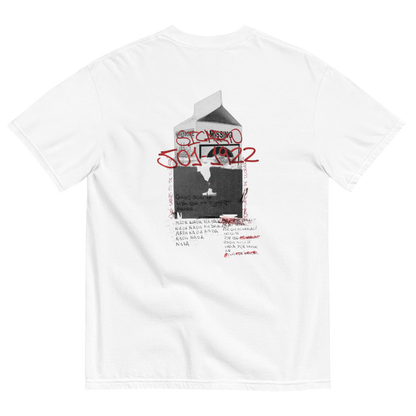 White short-sleeve t-shirt showing the back side with a graphic print of a milk carton containing a black-and-white portrait, overlaid with red graffiti-style text reading 'STANLEY 1972' and small red handwritten text below.