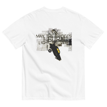 A white short-sleeve crewneck t-shirt shown from the back, featuring a large graphic print with the text 'MAY, THE BRIDGES LIGHT THE WAY' and a black car illustration over a distressed gray background.