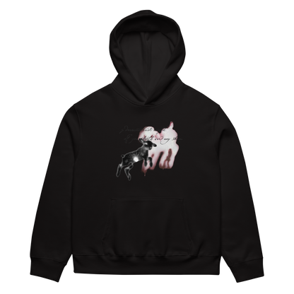 A black pullover hoodie with a front kangaroo pocket and a graphic print on the chest showing a black-and-white dog silhouette over a pink-and-white dripping heart, with cursive text above.