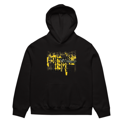 A black pullover hoodie with a yellow and black graphic print on the chest featuring a collage of people and the text 'This is what I do when I sleep'.