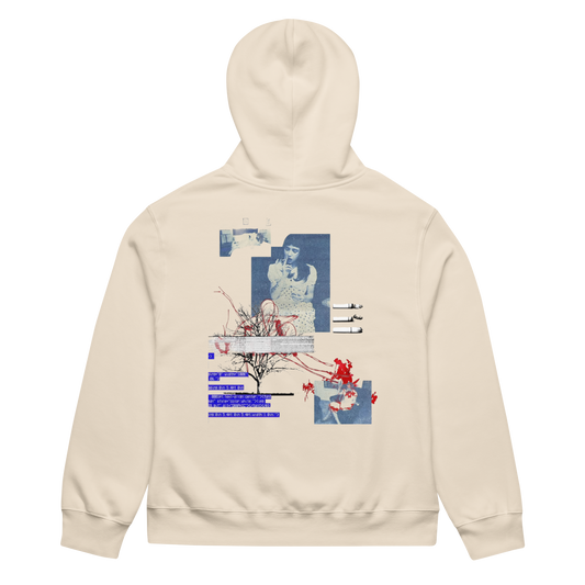 A cream-colored hoodie shown from the back, featuring a large graphic collage print with blue and red elements and Japanese text.