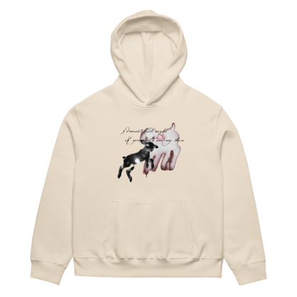 A cream-colored hoodie featuring a graphic print of a black dog jumping in front of a pink dog silhouette, with the text 'I dreamed of my tail if you didn't pull my tail.' on the chest, displayed on a clean white background.