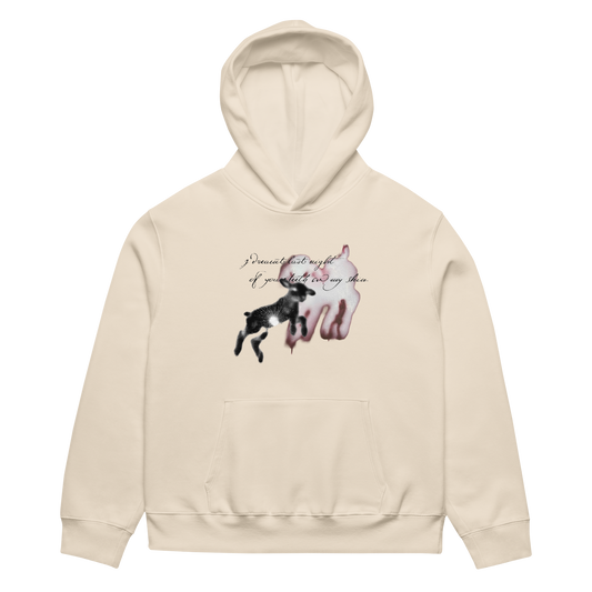 A cream-colored hoodie featuring a graphic print of a black dog jumping in front of a pink dog silhouette, with the text 'I dreamed of my tail if you didn't pull my tail.' on the chest, displayed on a clean white background.