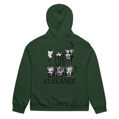 A dark forest green hoodie shown from the back, featuring a distressed black graphic print with the text 'THE ART OR PAIN' and 'ELEGANCE' alongside stylized portraits.