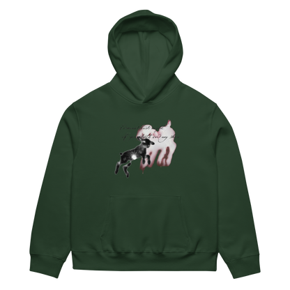 A dark forest green pullover hoodie with a graphic print on the chest featuring a black and white spotted deer jumping in front of a white goat with pinkish-red highlights, and cursive text above.