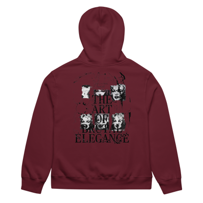 A maroon hoodie shown from the back, featuring a large black graphic print with the text 'THE ART OF BRITISH ELEGANCE' and stylized portrait illustrations.