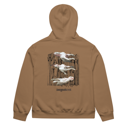 A tan hoodie shown from the back, featuring a graphic print of four white pelicans flying in front of a dark vertical wooden fence, with the word 'impatient' printed below in black.